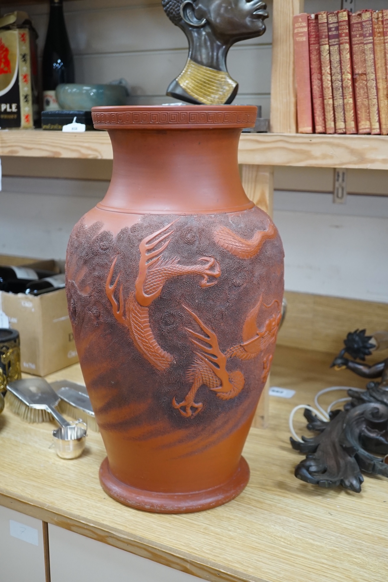 A large Japanese terracotta dragon decorated vase, 50cm high. Condition - hole drilled to base